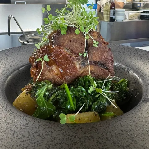 Carlton Farms Pork with roasted potatoes and greens